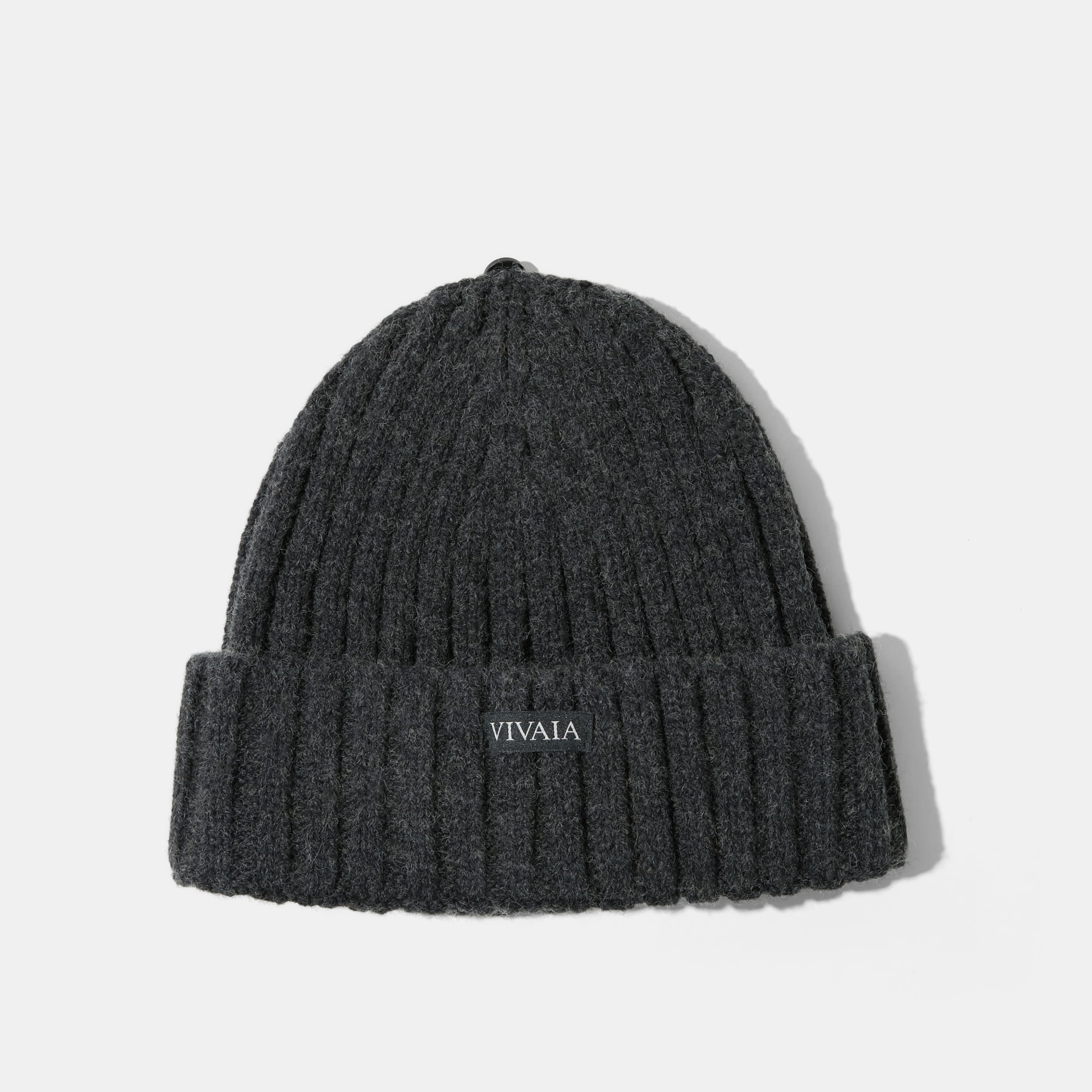 Knitted hat with removable pom pom