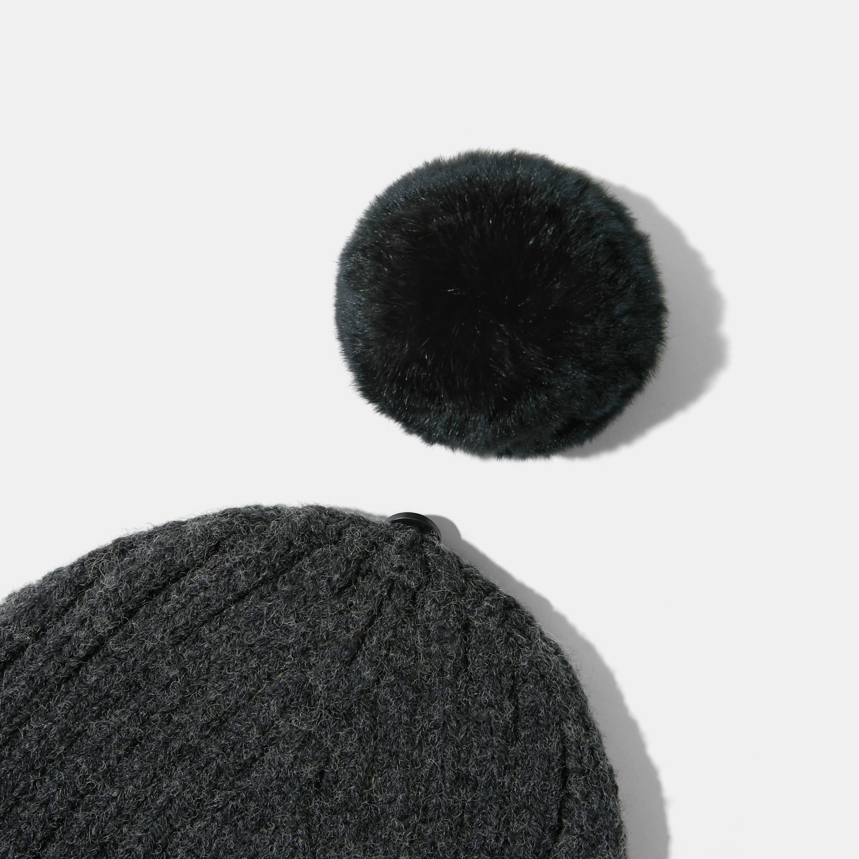Knitted hat with removable pom pom