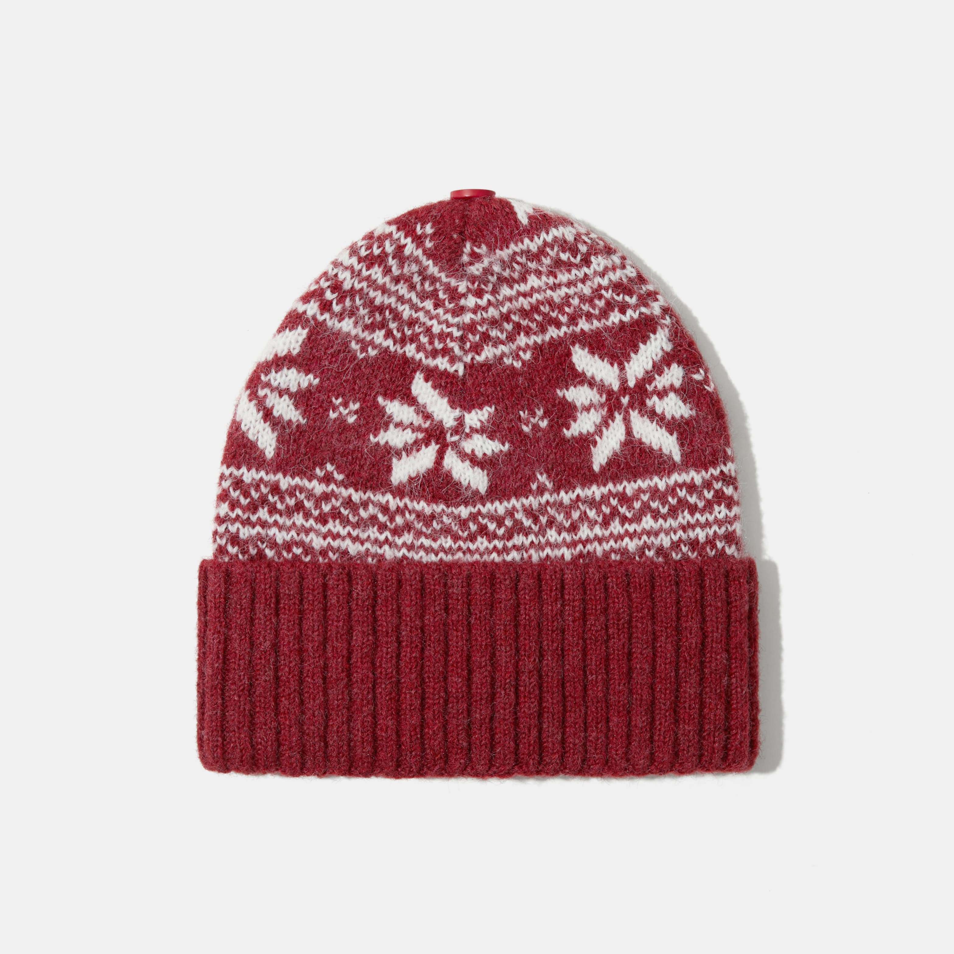 Knitted hat with removable pom pom